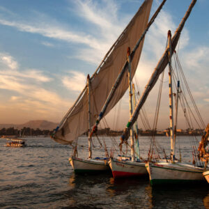 shot-numerous-boats-berthed-by-pier-straight-lines-sunset