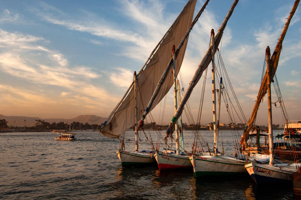 shot-numerous-boats-berthed-by-pier-straight-lines-sunset